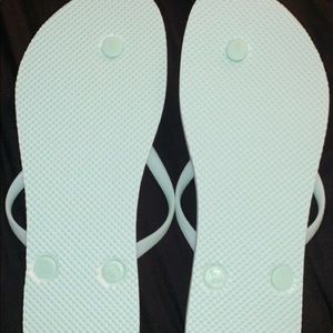 Mint green/teal flip flops